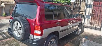 jeepetas y camionetas - Jeep Mitsubishi Montero IO 2000 roja